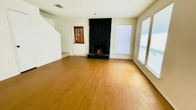 Unfurnished living room featuring a wealth of nat