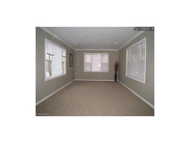 Living room with new carpet and lots of natural li