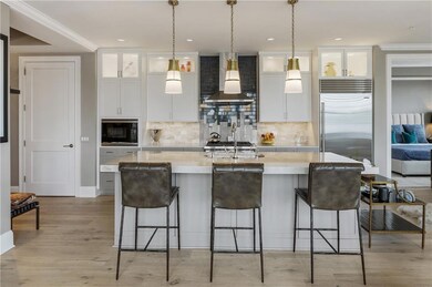 Kitchen with wall chimney exhaust hood, built in a