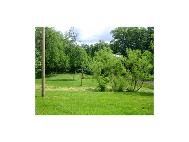 Mature trees surround the property