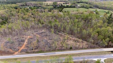Aerial view featuring a view of trees