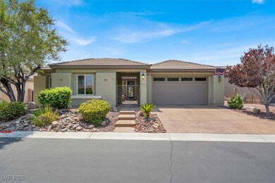 View of front of house featuring driveway, a garag