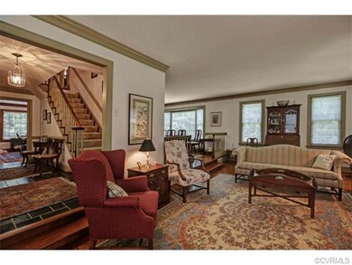 Dining room beyond living room with walk-out bay w
