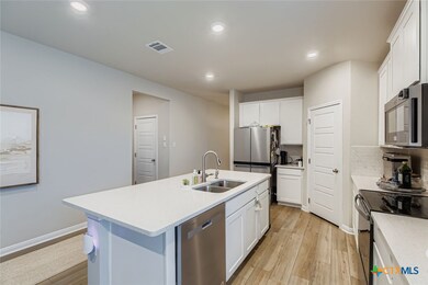 Kitchen - Stainless Steel Appliances + Quartz Countertops