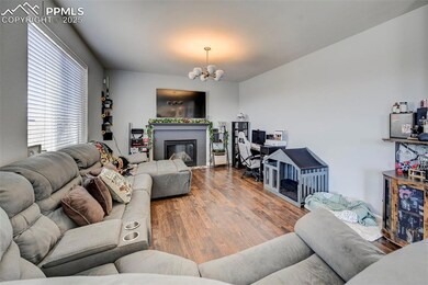 Living area featuring a glass covered fireplace, w