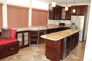 Oversized granite topped island with built in wine