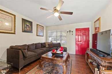 Living room with dark hardwood / wood-style floori