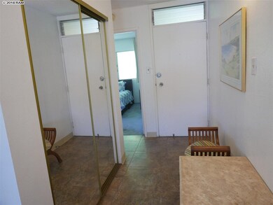 Entry, hallway and bathroom have large ceramic til