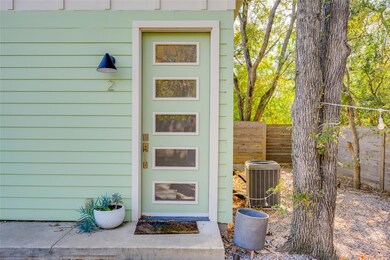 Entrance to property with fence and cooling unit