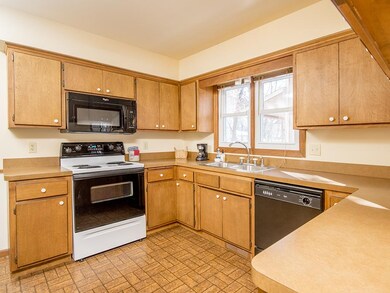Spacious kitchen with original birch cabinets offe
