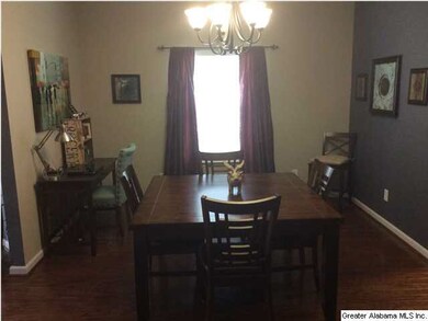 Very large dining room with hardwoods.