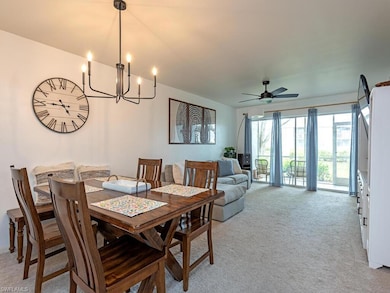 Dining room with light colored carpet and ceiling 