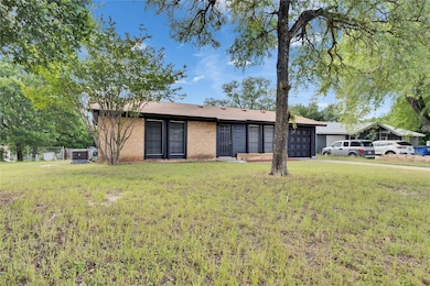 View of front of home with an attached garage, a 
