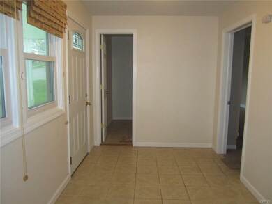 Nice ceramic tile entryway with closet leads to bo