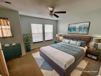 Bedroom with carpet flooring and ceiling fan