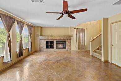 Unfurnished living room with a tile fireplace, st