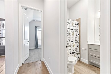 From the foyer, a hallway leads to two guest bedro