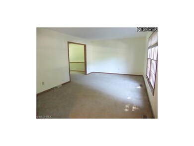 This space features neutral carpet and walls.