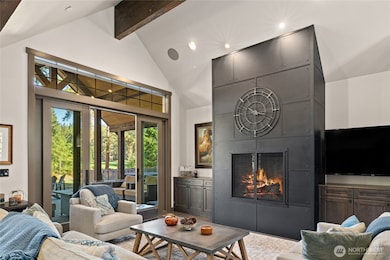 Metal fireplace and slider door to outdoor patio