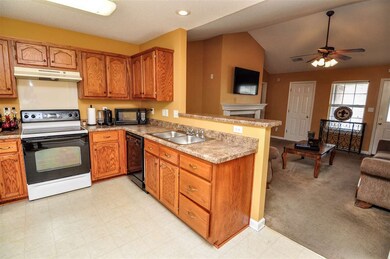 The kitchen is open to the great room and is separ