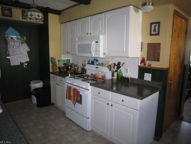Stove and built-in microwave area.