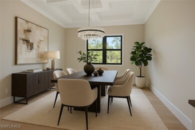 Dining space with crown molding, coffered ceiling,