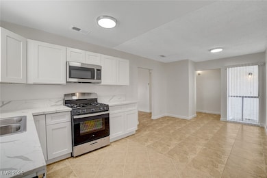 Kitchen with appliances with stainless steel finis