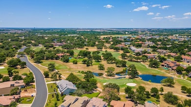 Aerial view featuring a water view, view of golf 