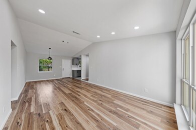 Empty room with light hardwood / wood-style floors