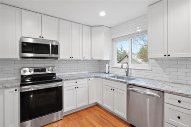 Quartz Countertops, Tile Backsplash, Stainless App
