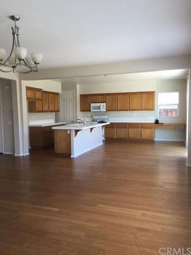 Kitchen area with breakfast bar and desk area.