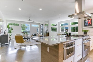 Kitchen with island exhaust hood, stainless steel