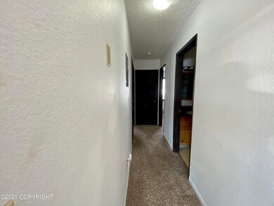 Hallway to bedrooms and bathroom