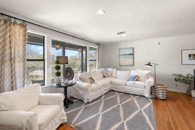 Living room with ornamental molding, visible vent