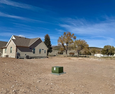 View of property exterior with a patio area and a central air condition unit