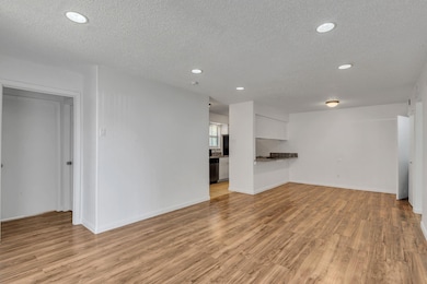 Unfurnished living room with light hardwood / wood