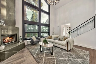 Great Room with high ceilings and Pietra Grey marb