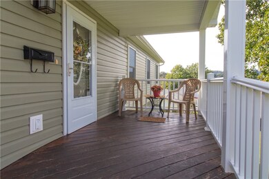 The front entrance has a spacious deck for relaxin