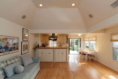 open floor plan and vaulted ceilings