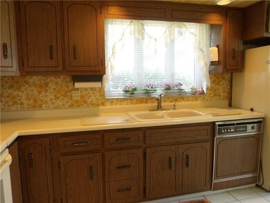 Eat in kitchen with man door leading to the covere