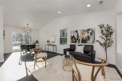 Living room featuring a wealth of natural light, a
