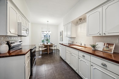 Beautiful kitchen featuring Solid Wood Butcher Blo