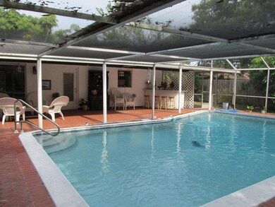 Screened in pool w/ covered patio