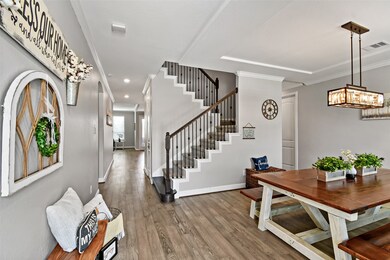 Beautiful wood flooring in the entry and formal di