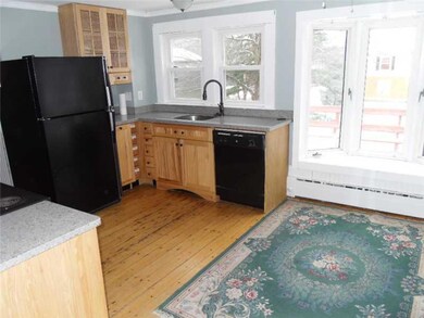 Kitchen with bright dining area.
