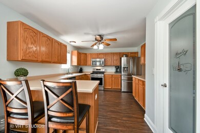 Spacious kitchen has new flooring, brand new stain
