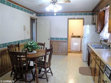 Kitchen - Leads to large utility room with access 