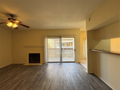 Living room view with kitchen to the right