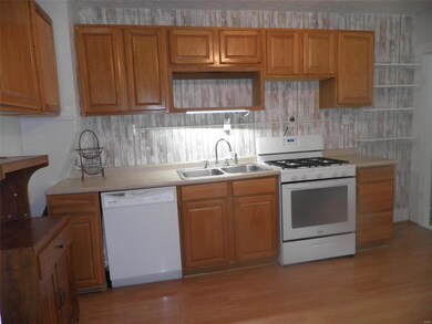 Updated appliances and 5 burner gas range.