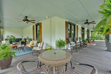 Deck featuring ceiling fan and outdoor lounge area
